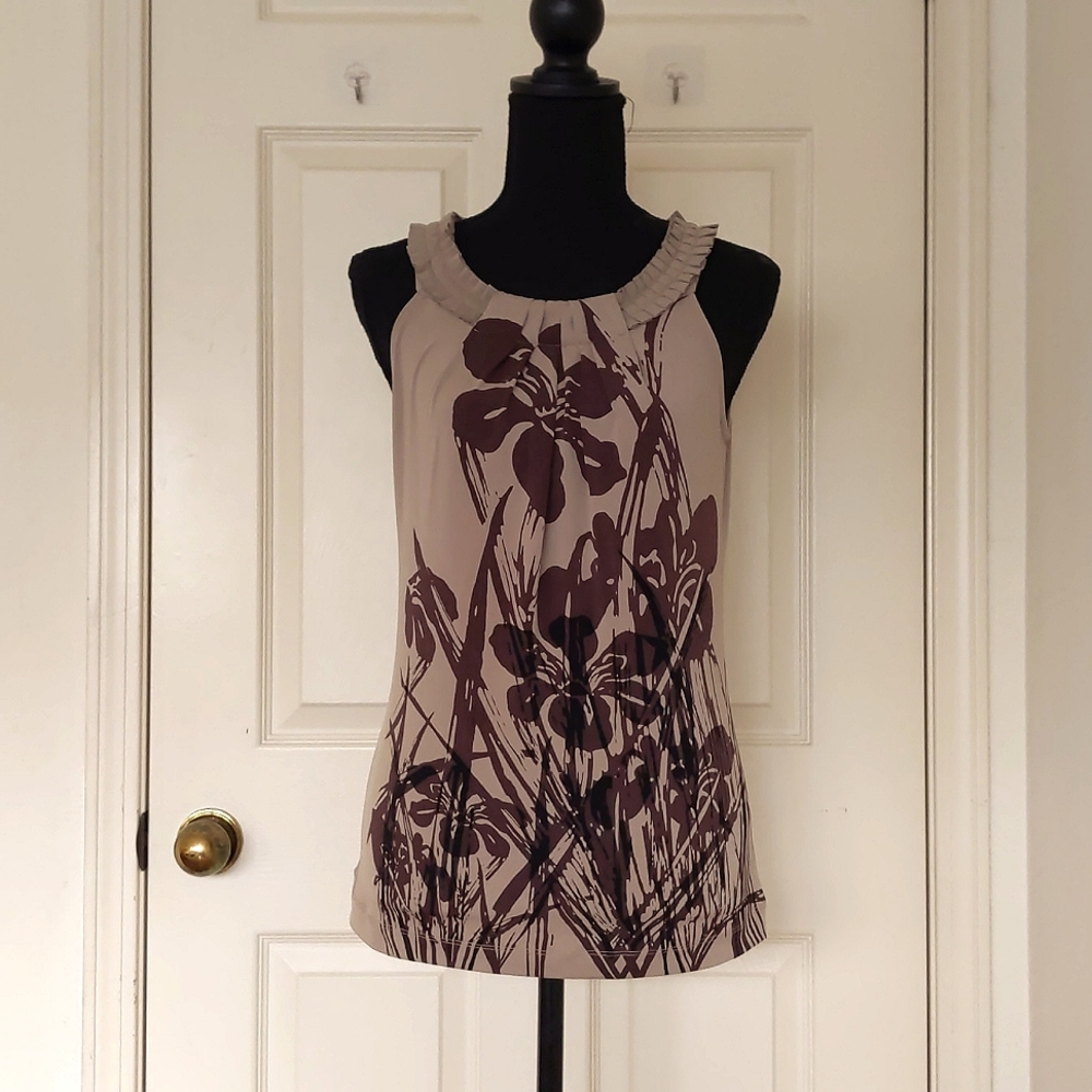 NWT. The Limited Stretch Sleeveless Floral Blouse with neckline design.